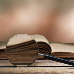 Magnifying Glass in front of book
